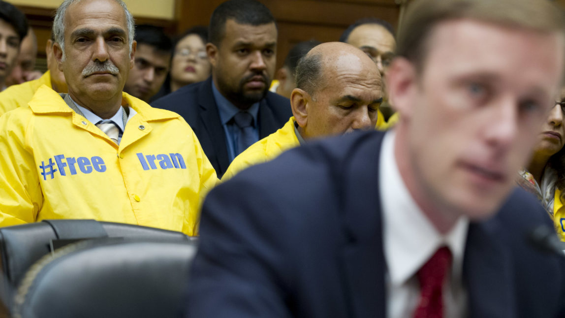 Members of the Iranian American community listen Former State Department Director of Policy Planning Jake Sullivan during a hearing on Iran before the House Foreign Affairs Committee at Capitol Hill in Washington on Wednesday, Oct. 11, 2017. (AP Photo/Jose Luis Magana)