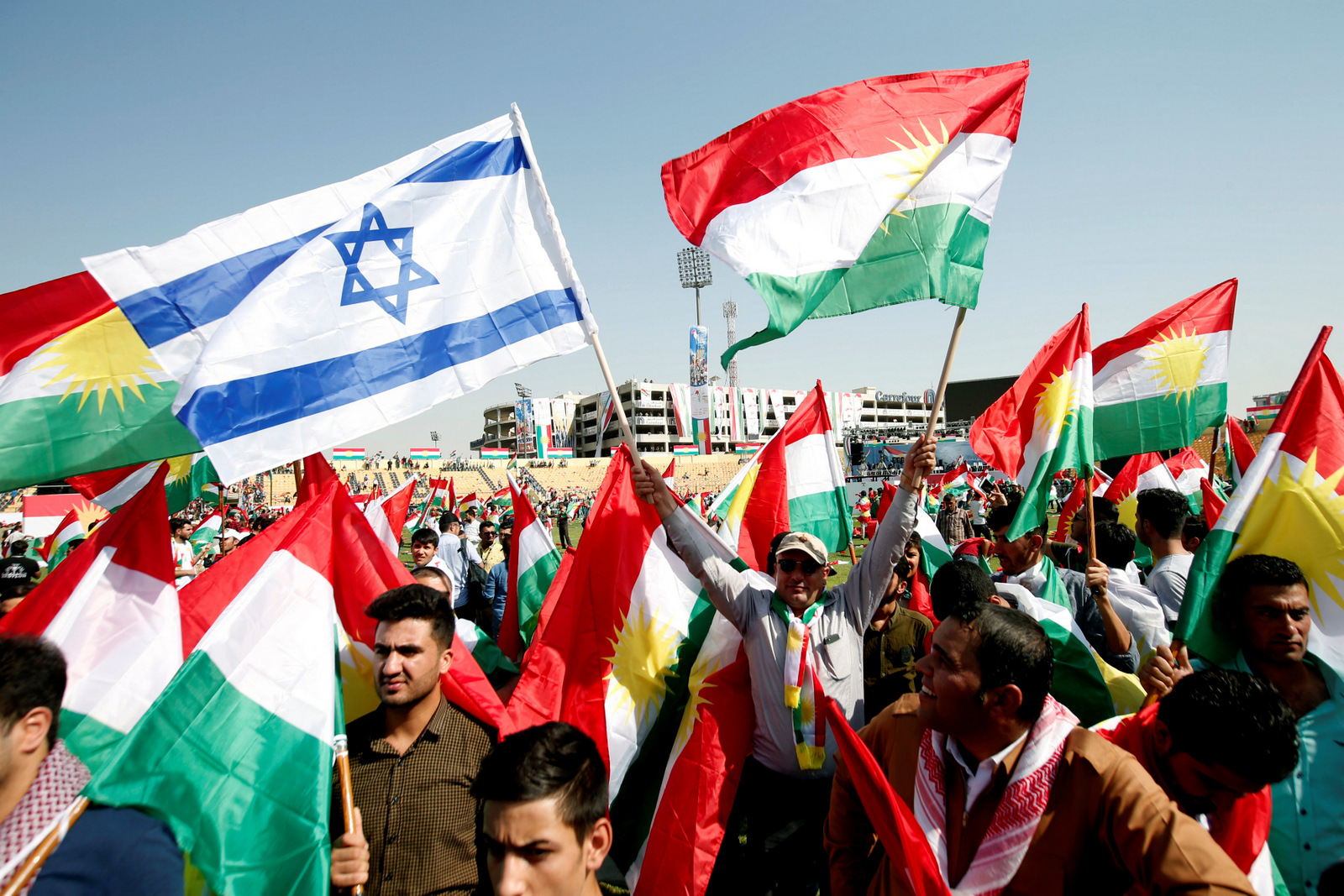 Kurds carry Israeli and Kurdish flags to show their support for the September 25th independence referendum in Erbil, Iraq, September 22, 2017. (Azad Lashkari/Reuters)