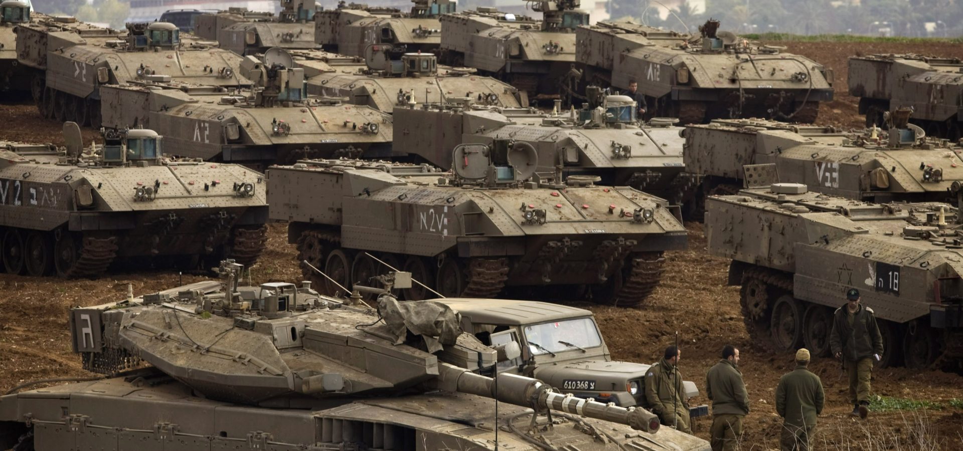 Israeli tanks are seen near Israel's border with the Gaza Strip, in southern Israel, Dec. 29, 2008 as Israel widened its deadliest-ever offensive against Gaza targeting homes, tunnels and government buildings. AP/Sebastian Scheiner)