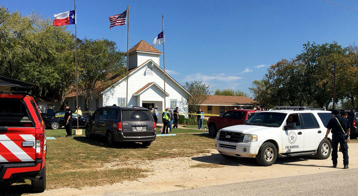 Law enforcement officials works at the scene of a fatal shooting at the First Baptist Church in Sutherland Springs, Texas, on Sunday, Nov. 5, 2017. (Nick Wagner/Austin American-Statesman via AP)