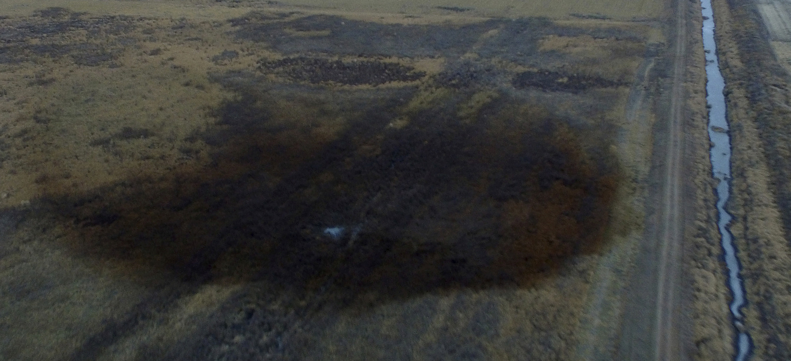 This aerial photo shows spills from TransCanada Corp.'s Keystone pipeline, Nov. 17, 2017, that leaked an estimated 210,000 gallons of oil onto agricultural land in northeastern South Dakota, near Amherst, S.D. (DroneBase/AP)