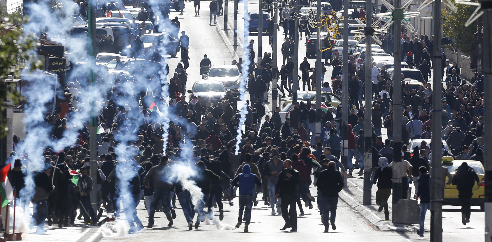 Israeli troops fire teargas towards Palestinians during a protest against U.S. President Donald Trump's decision to recognize Jerusalem as the capital of Israel in the West Bank city of Bethlehem,, Dec. 7, 2017. (AP/Nasser Shiyoukhi)