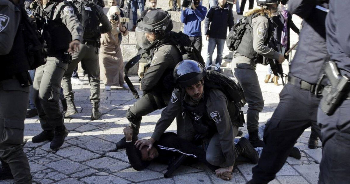 Israeli police officers pin down a Palestinian protester during a demonstration against U.S. President Donald Trump’s decision to recognize Jerusalem as the capital of Israel, outside Damascus Gate in Jerusalem’s Old City, Dec. 8, 2017. (AP/Mahmoud Illean)