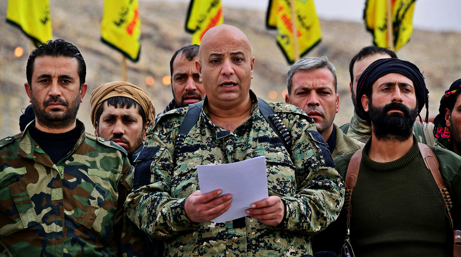 Former spokesman of the Syrian Democratic Forces (SDF), Talal Silo, pictured center, delivers a prepared statement to the press. (Photo: Twitter)