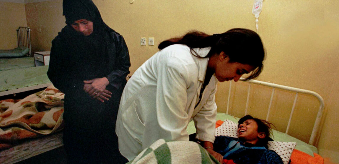 Dr. Buthayna Shibel examines a girl at the Mahawil hospital in Babylon, Iraq, Dec. 23, 1998. Economic sanctions imposed by the United States left Iraqi hospitals critically short of medicine. (AP/Murad Sezer)