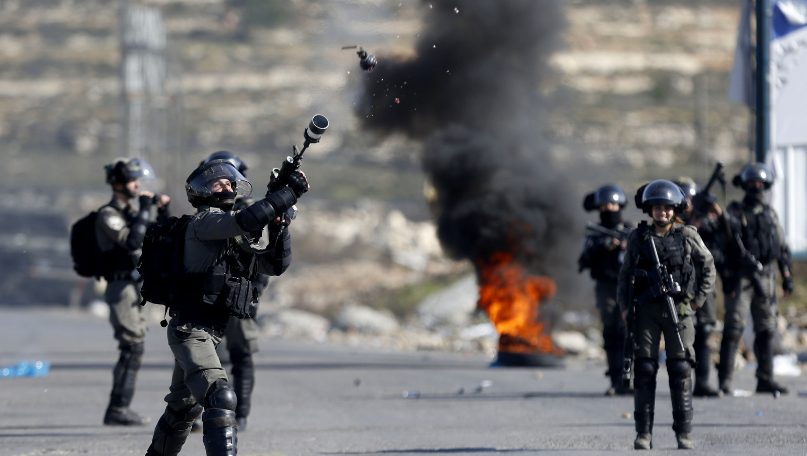 Israeli police fire tear gas at Palestine protesters during protests against US. President Donald Trump's decision to recognize Jerusalem as the capital of Israel. Ramallah, Occupied Palestine. Feb 2, 2018. (AP/Majdi Mohammed)