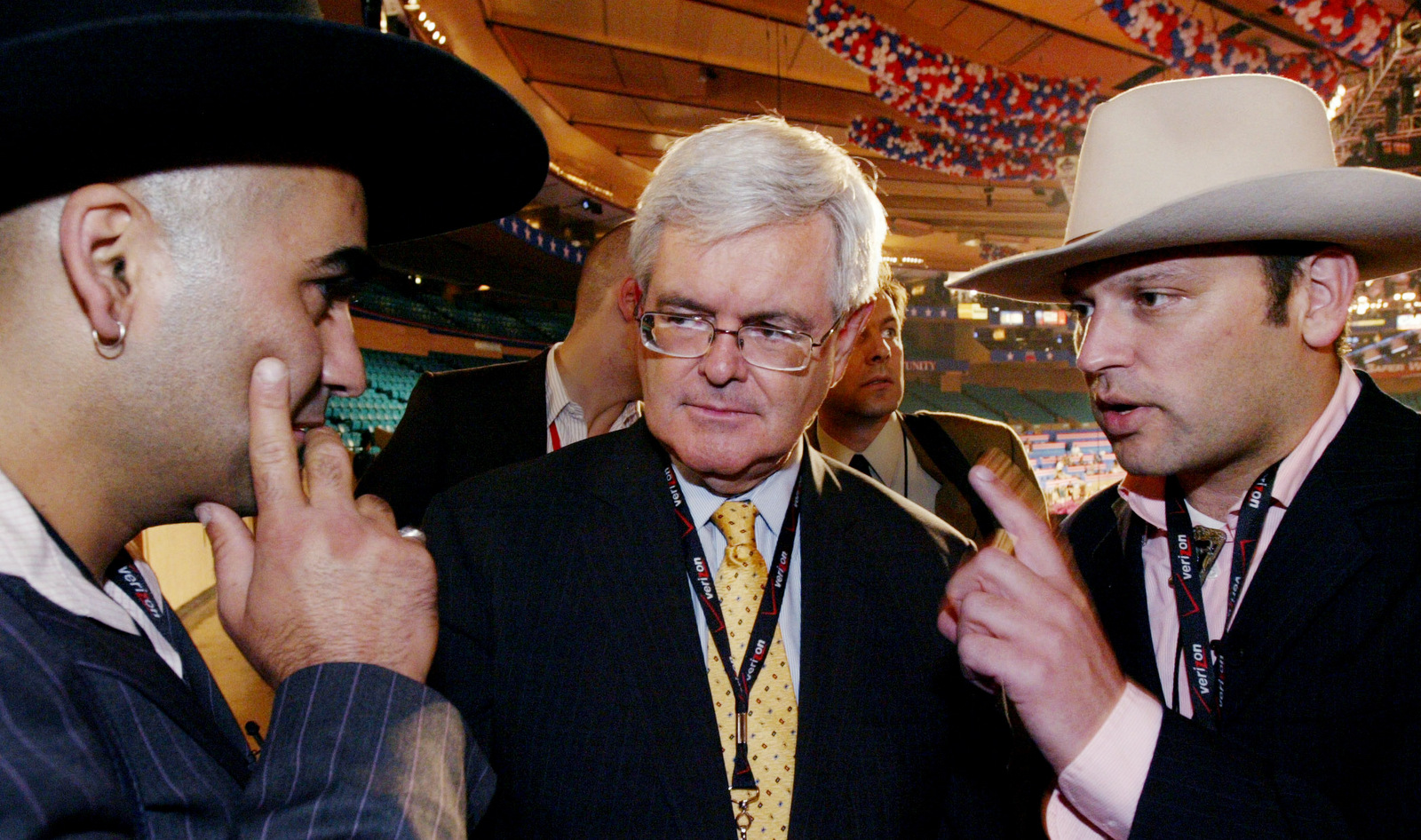 Newt Gingrich, center, former Speaker of the U. S. House of Representatives, is interviewed by Dutch television journalists Gideon Levy, left, and Bahram Sadeghi at the Republican National Convention in Madison Square Garden, Sept. 1, 2004 in New York. (AP/Gregory Bull)