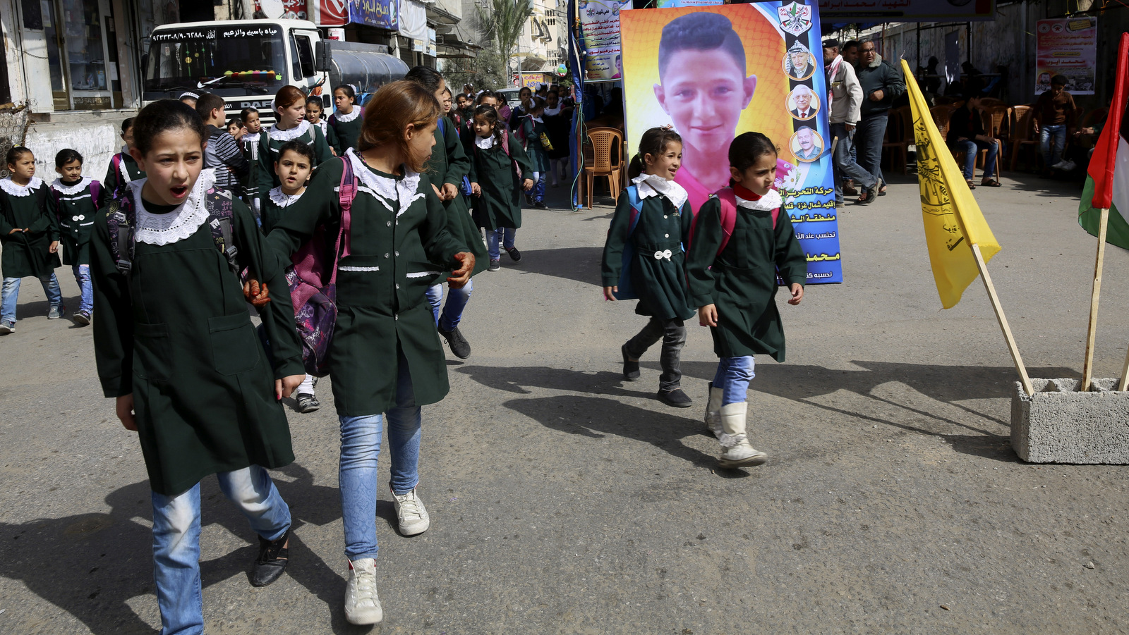 School girls look while pass the house morning of Mohammed Ayyoub, 14, who was killed by Israeli soldiers during a protest on Gaza's border with Israel, east of Jebaliya,, April 21, 2018. Adel Hana | AP