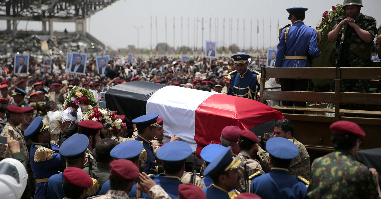 Yemeni honor guards carry the coffin of Saleh al-Samad, a senior Houthi official who was killed by a Saudi-led coalition airstrike on April 19, during his funeral procession in Sanaa, Yemen, April 28, 2018. (AP/Hani Mohammed)