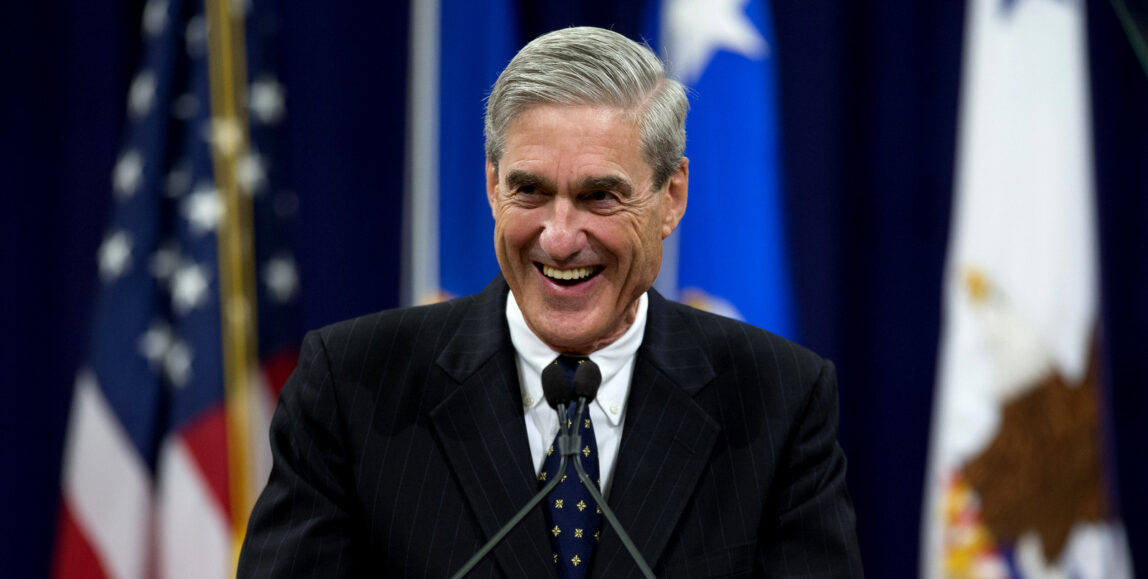 Outgoing FBI Director Robert Mueller smiles as he speaks at the Justice Department in Washington, Thursday, Aug. 1, 2013, during his farewell ceremony. Mueller is stepping down in September after 12 years heading the agency. (AP Photo/Evan Vucci) (AP Photo/Evan Vucci)