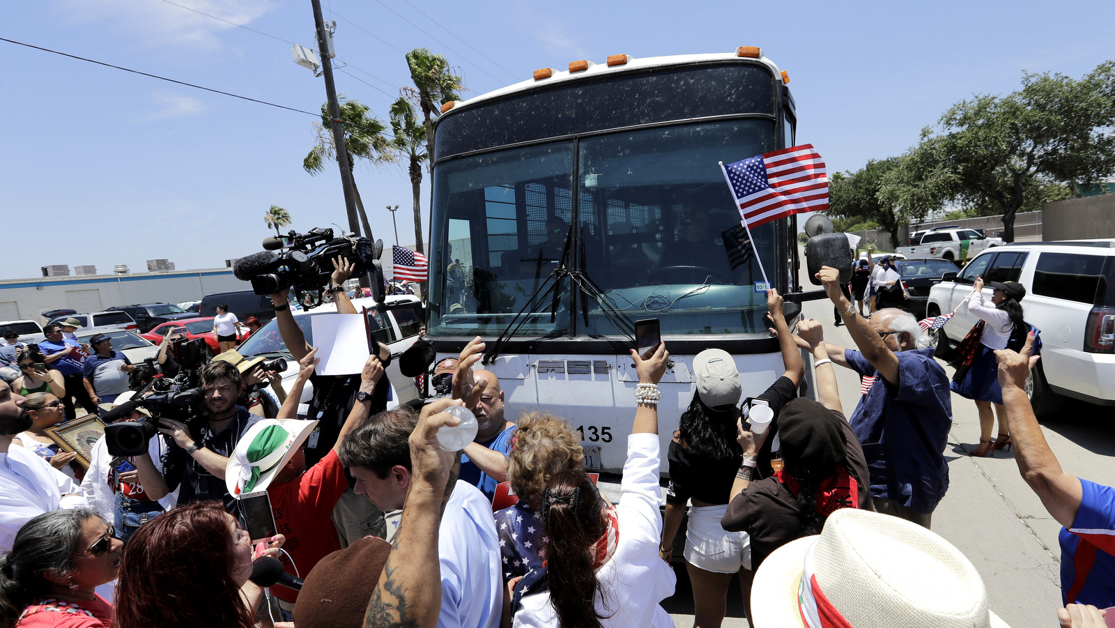 Protesters block a bus with immigrant children onboard during a protest outside the U.S. Border Patrol Central Processing Center, June 23, 2018, in McAllen, Texas. David J. Phillip | AP