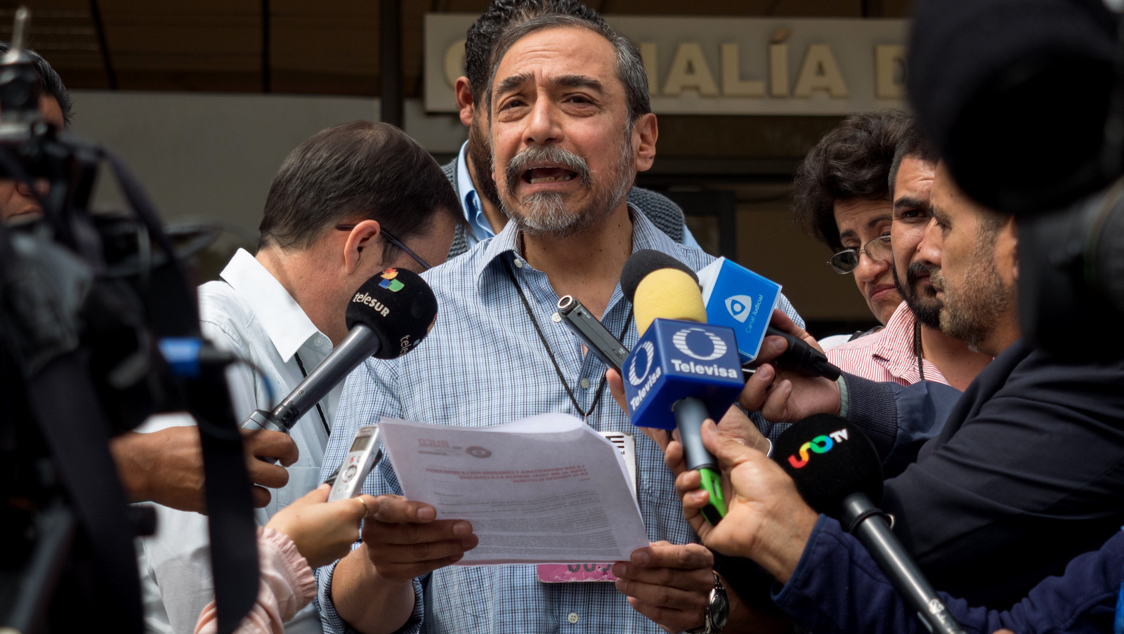 A supporter of the University and Citizen Network for Democracy addresses the media detailing their demands of the National Electoral Institute, Mexico City, June 21, 2018. José Luis Granados Ceja
