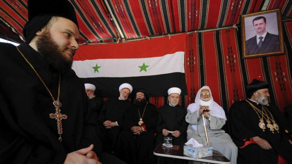 Muslim and Christian clerics gather inside a tent to express solidarity with Syria’s President Bashar al Assad. Photo | Reuters
