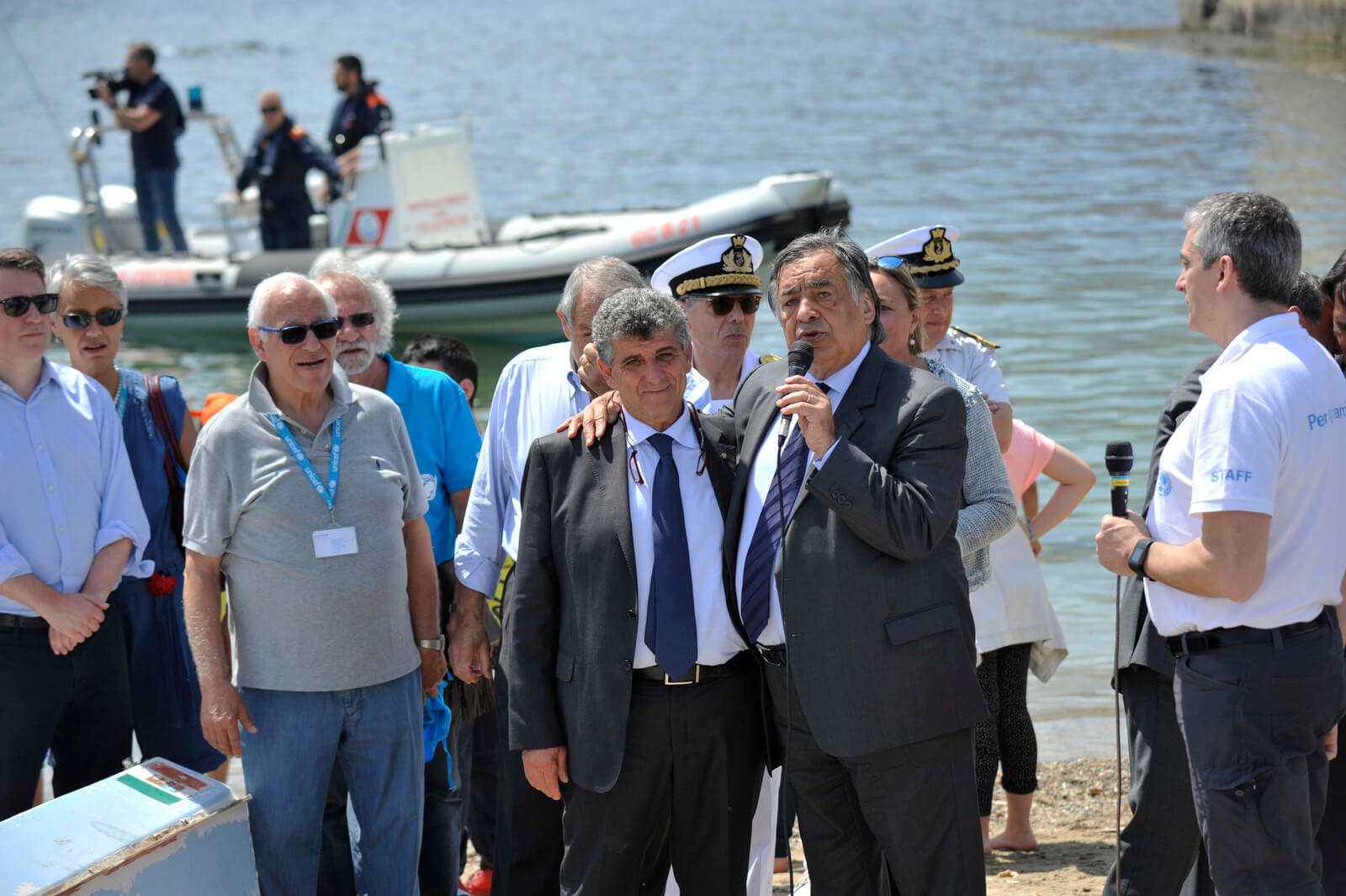Palermo Mayor Leoluca Orlando addresses tje Italian Coastguard, children, volunteers and officials taking part in a symbolic rescue of paper boats to send a message to the G7 leaders to take action to safeguard refugees in Palermo, Italy, May 25, 2017. Salvatore Cavalli | AP
