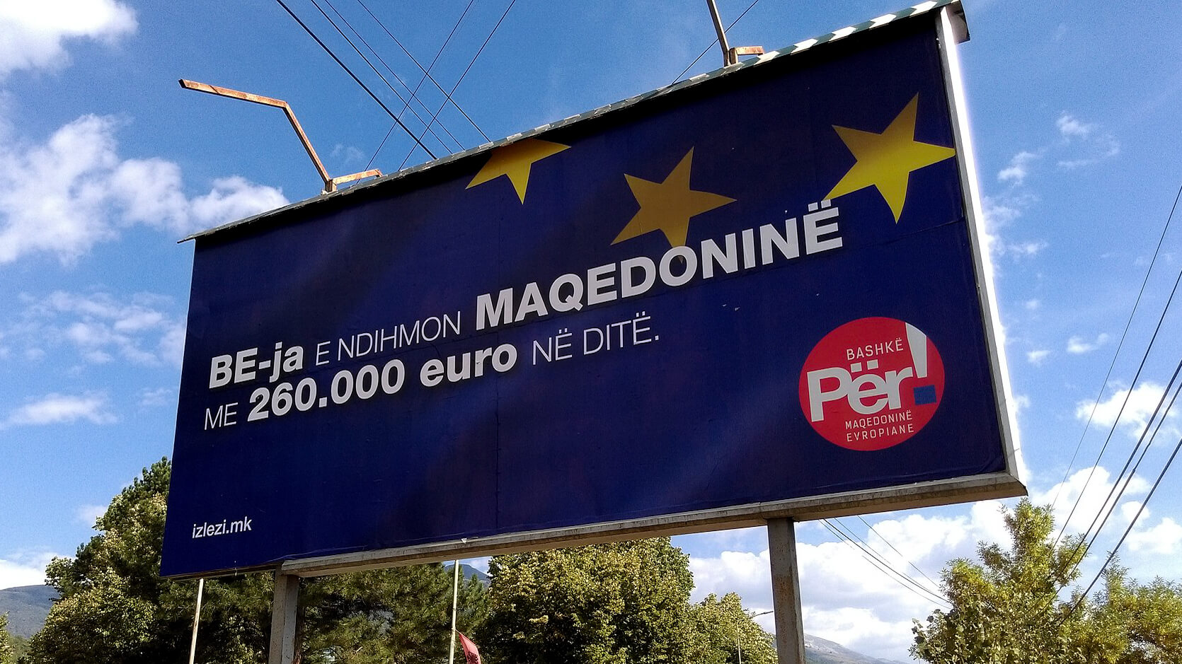A pro-Macedonian referendum billboard written in Albanian reads: The EU helps Macedonia with 260,000 euros a day. Together for a European Macedonia. Resnjari | Creative Commons