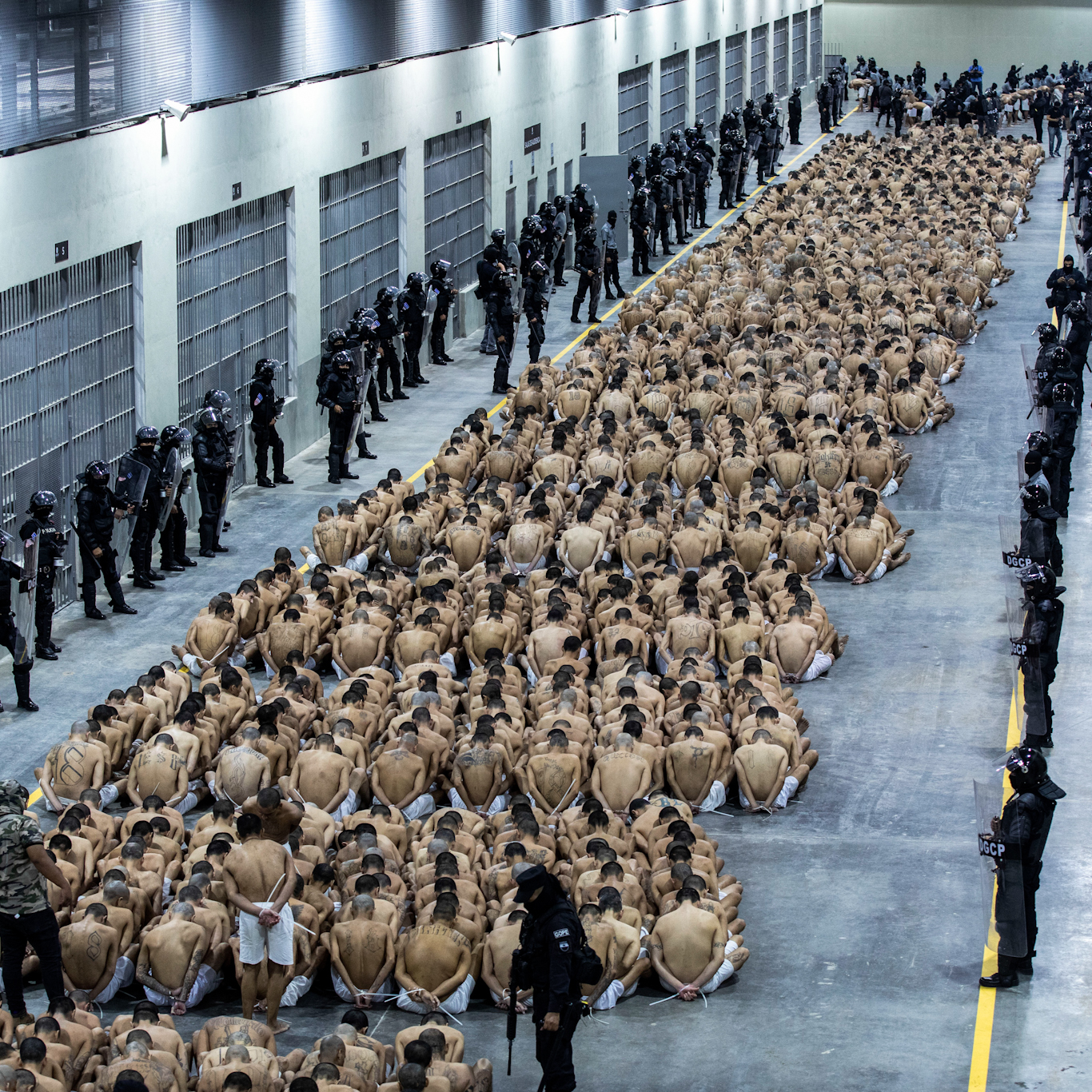 Inmates seated in El Salvador's mega-prison, March 2023