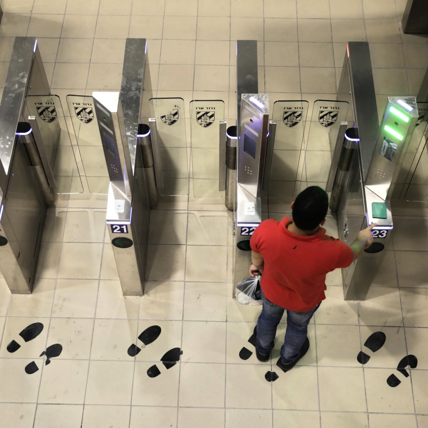 A Palestinian man passes through a biometric gate at the Qalandia crossing near Jerusalem. Sebastian Scheiner | AP